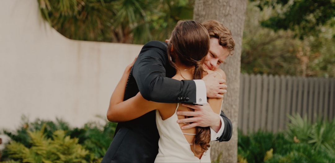 a man and a woman hugging each other
